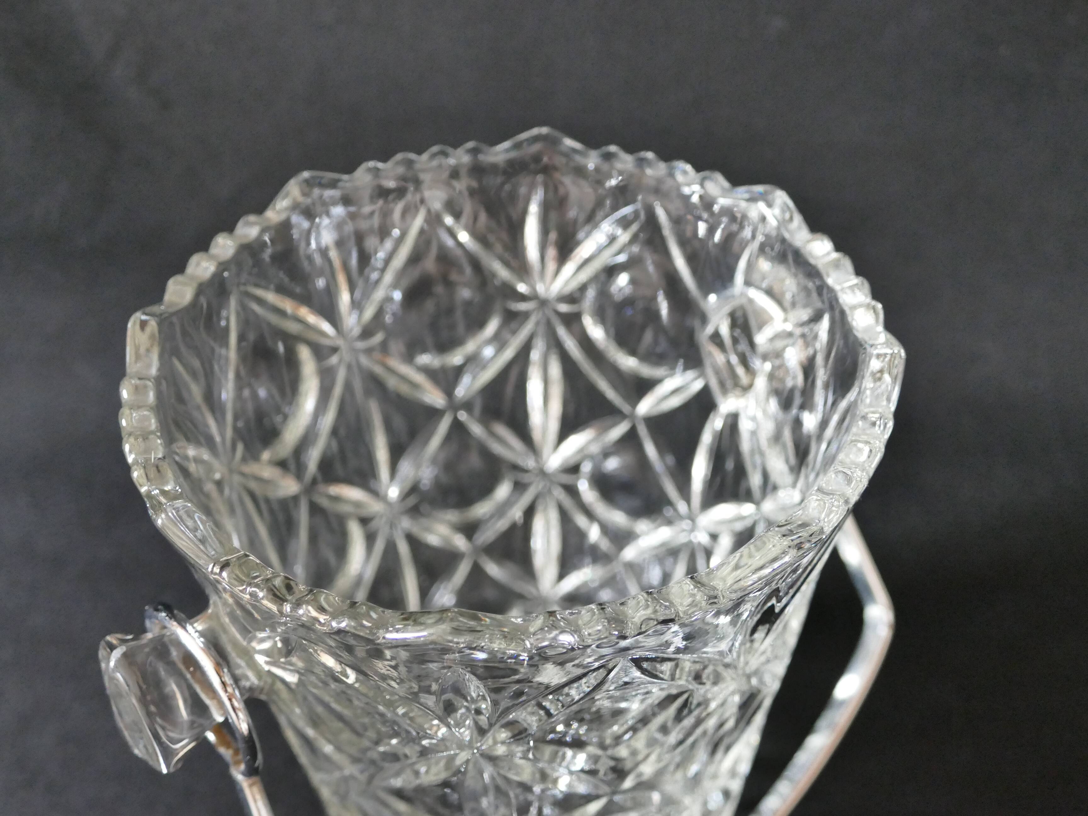 Vintage glass ice bucket stamped with a metal handle
