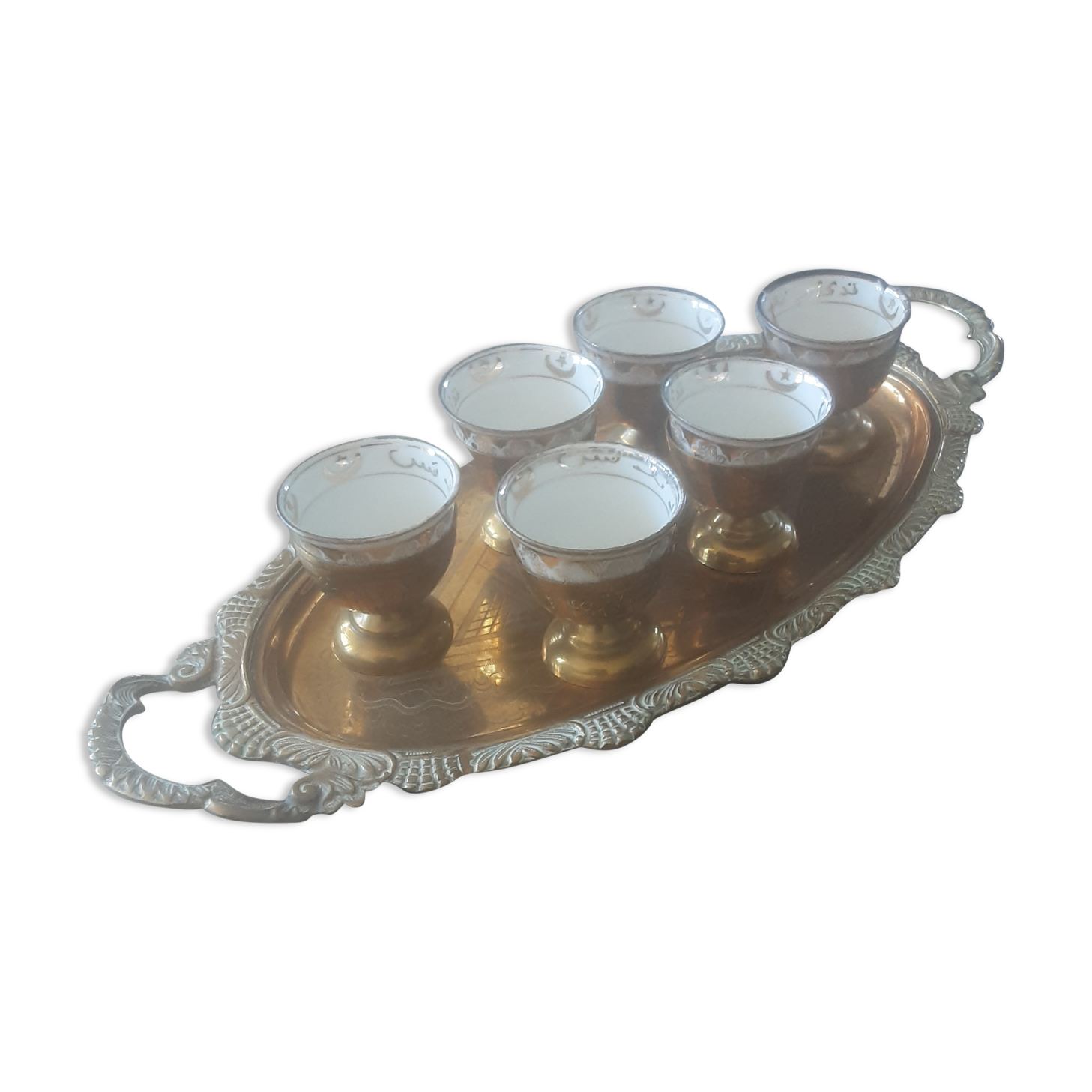 Old service porcelain brass cups