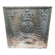 Old cast iron fireback with royal coat of arms