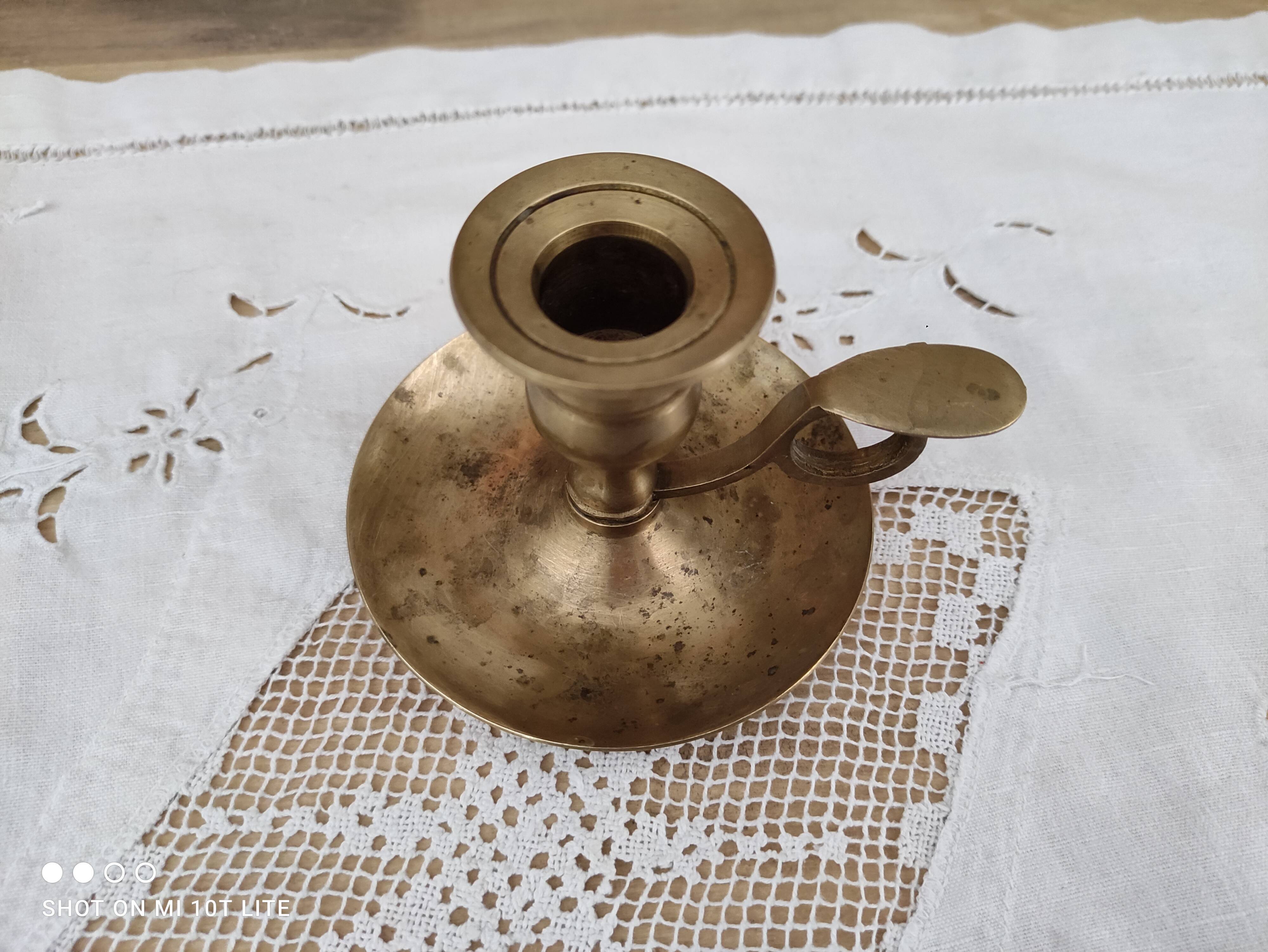 Hand candle holder called cellar rat in solid brass