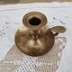 Hand candle holder called cellar rat in solid brass