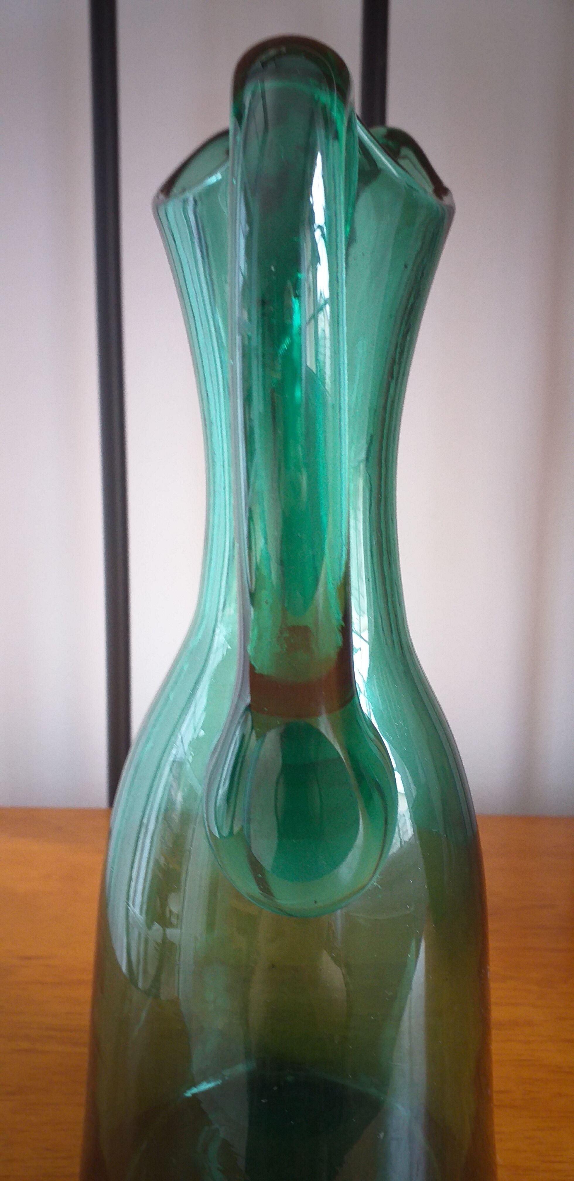 Pitcher made of green glass blown and tinted in the mass