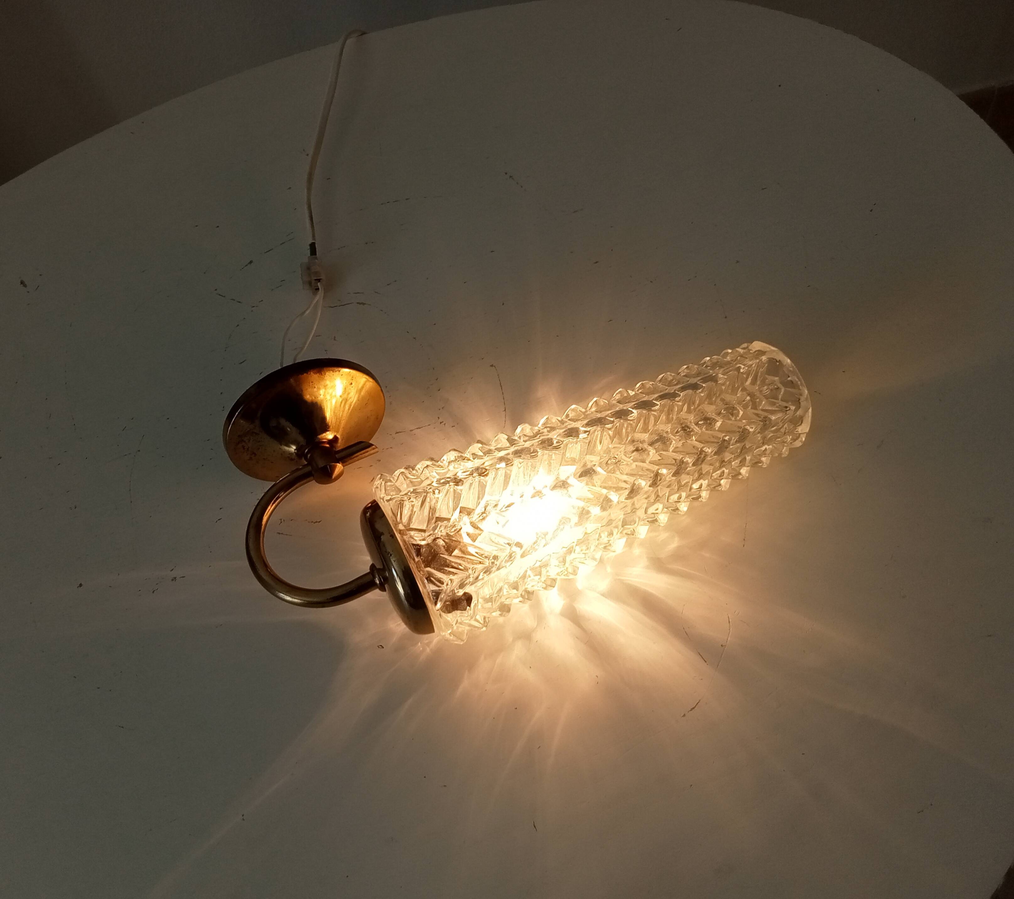 Vintage wall light in brass and etched glass.