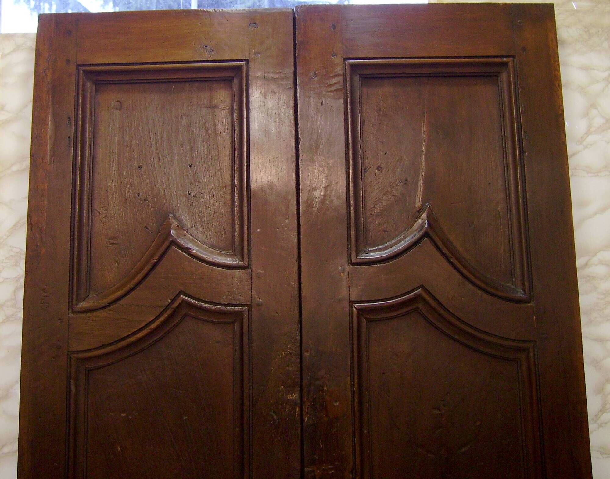 Pair of antique solid walnut doors from the 18th century.
