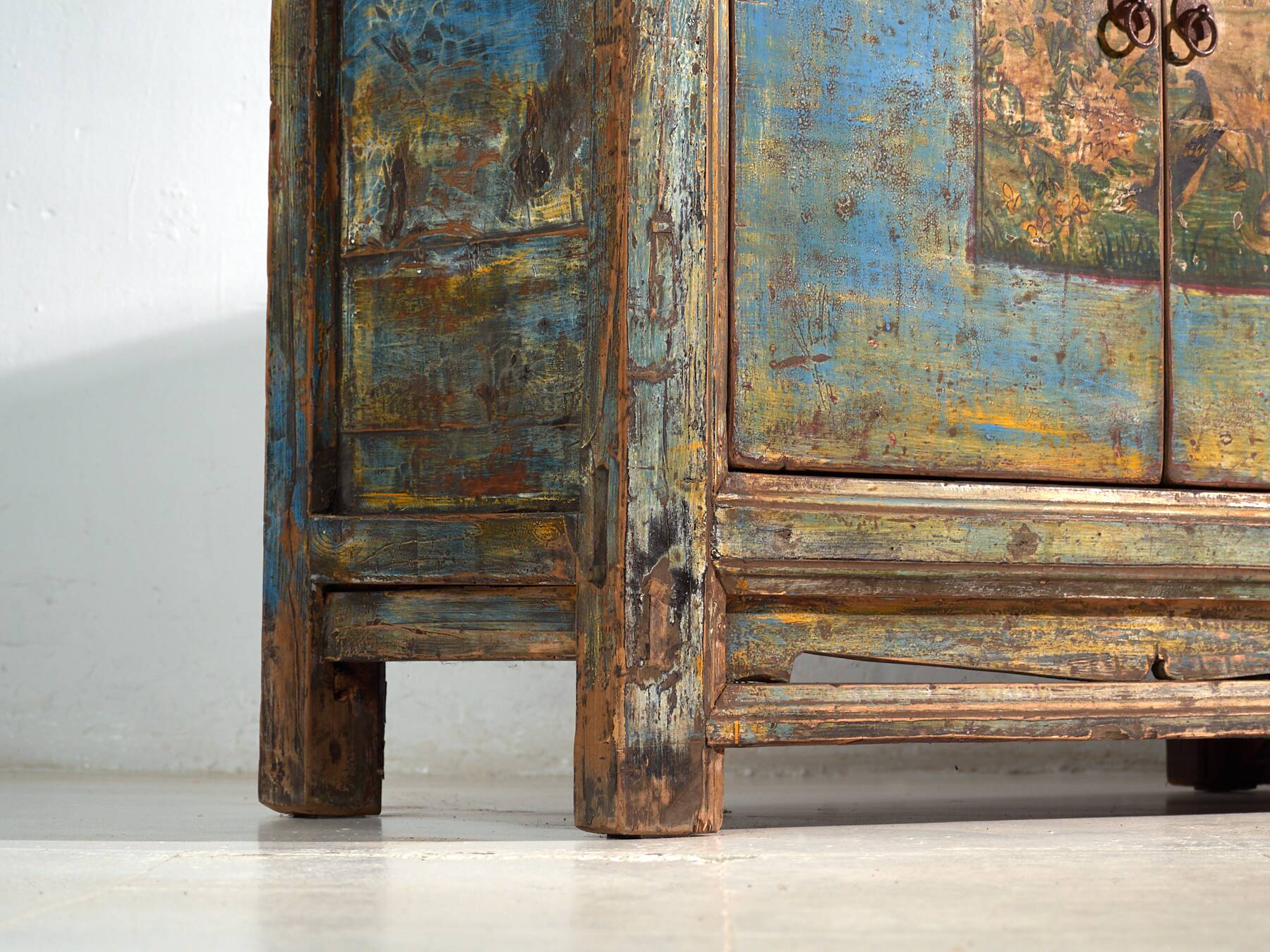 Old wooden entrance buffet in blue and yellow tones (circa 1920).