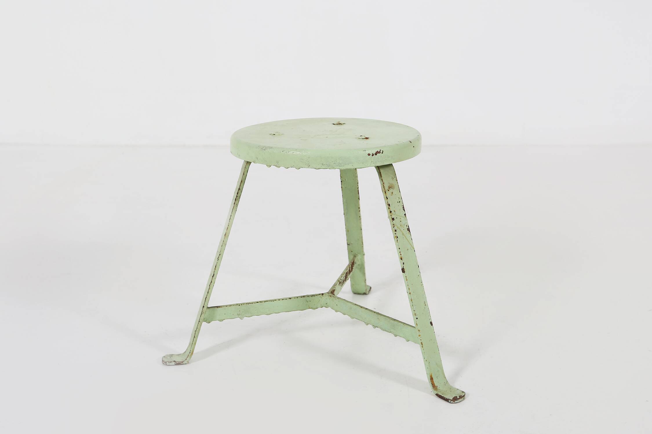 Industrial green painted stool with steel base and wooden top, France 1930s