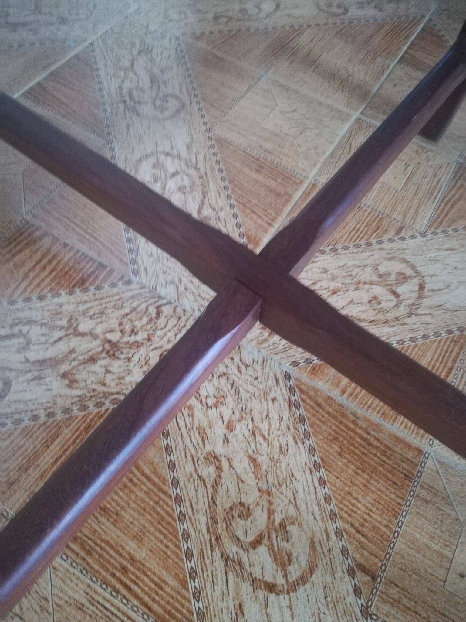 Round wooden table with thin legs