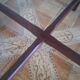 Round wooden table with thin legs
