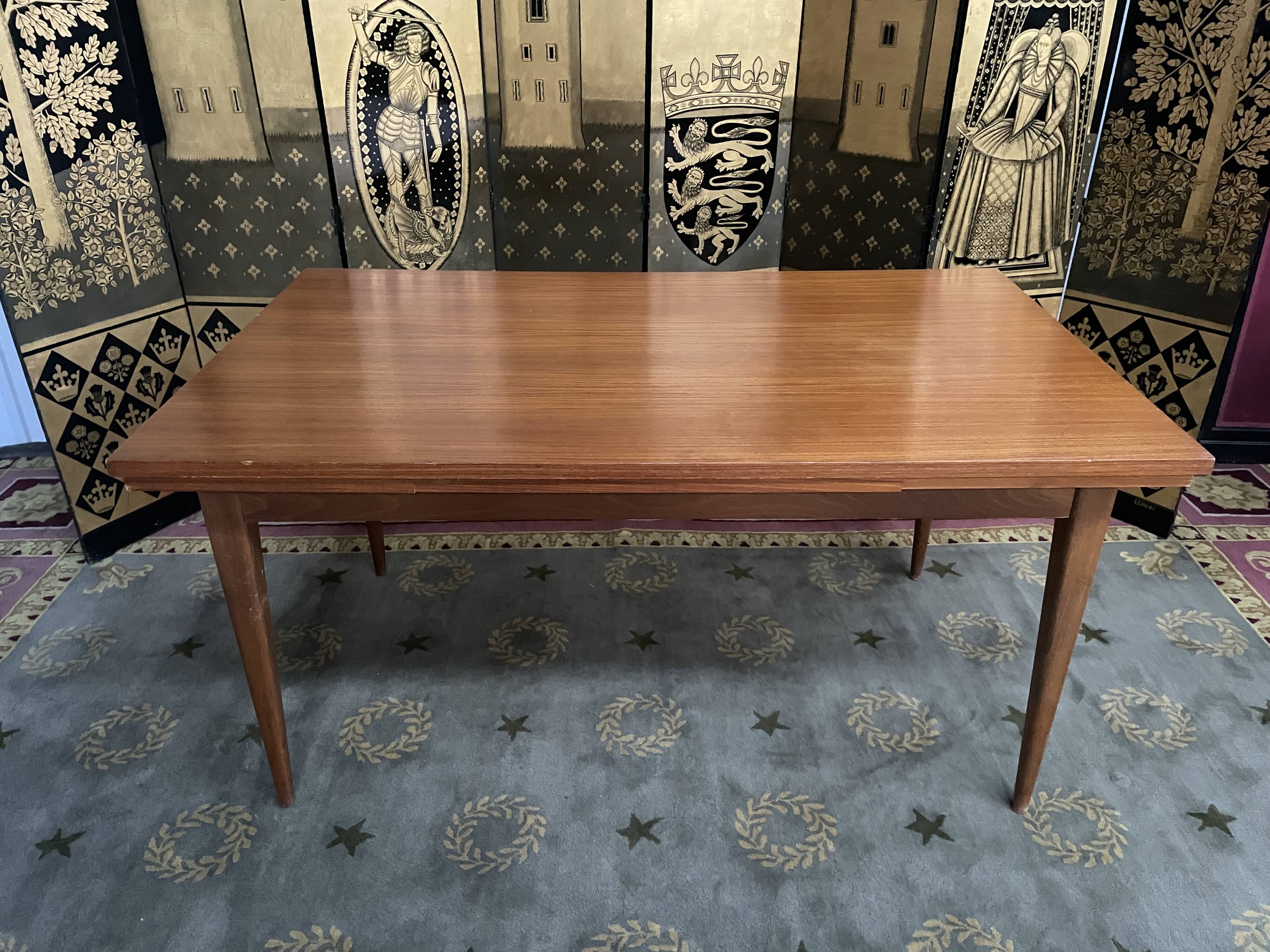 Scandinavian dining table with built-in extensions