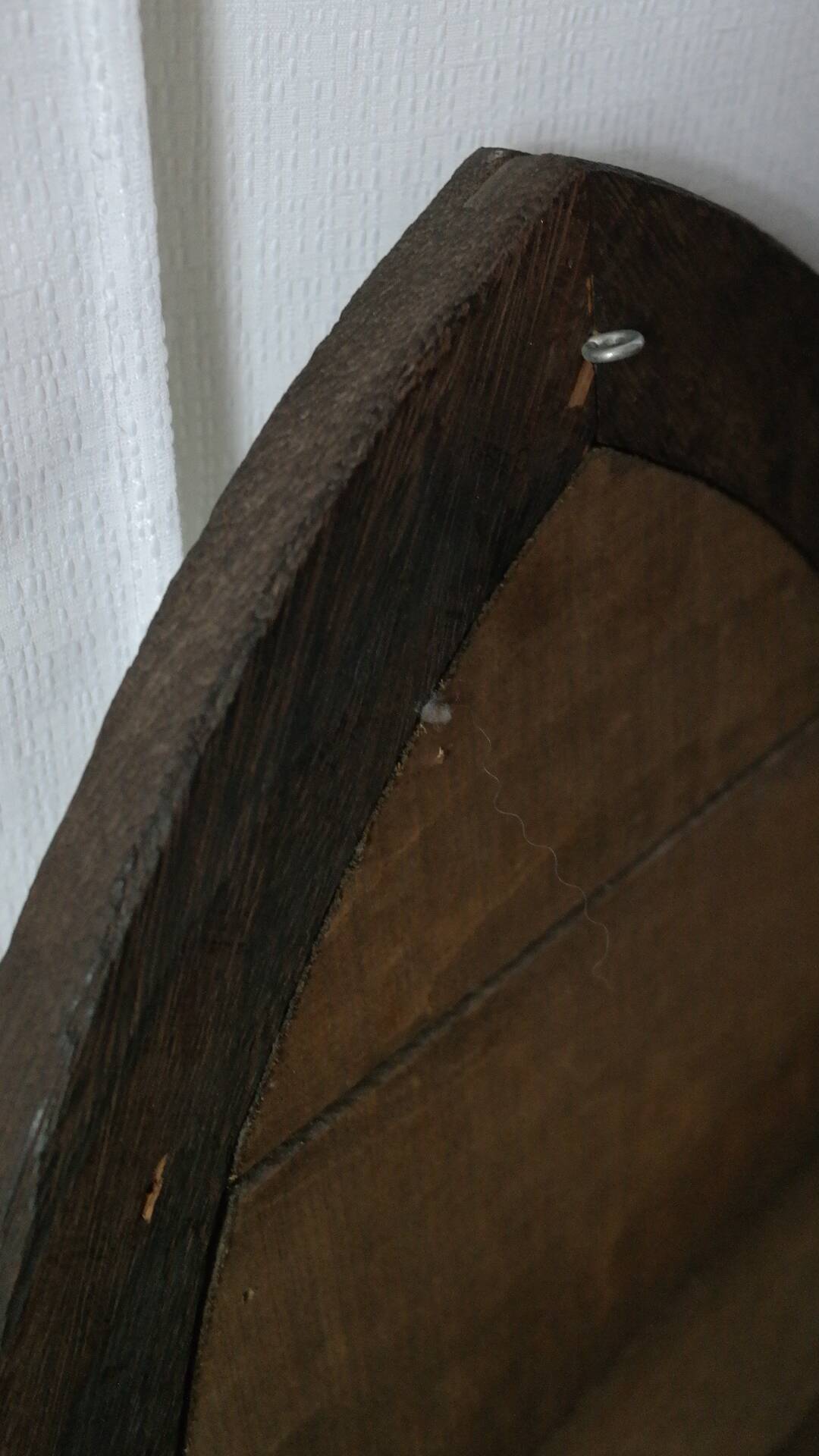 Old handcrafted Gothic style wooden mirror