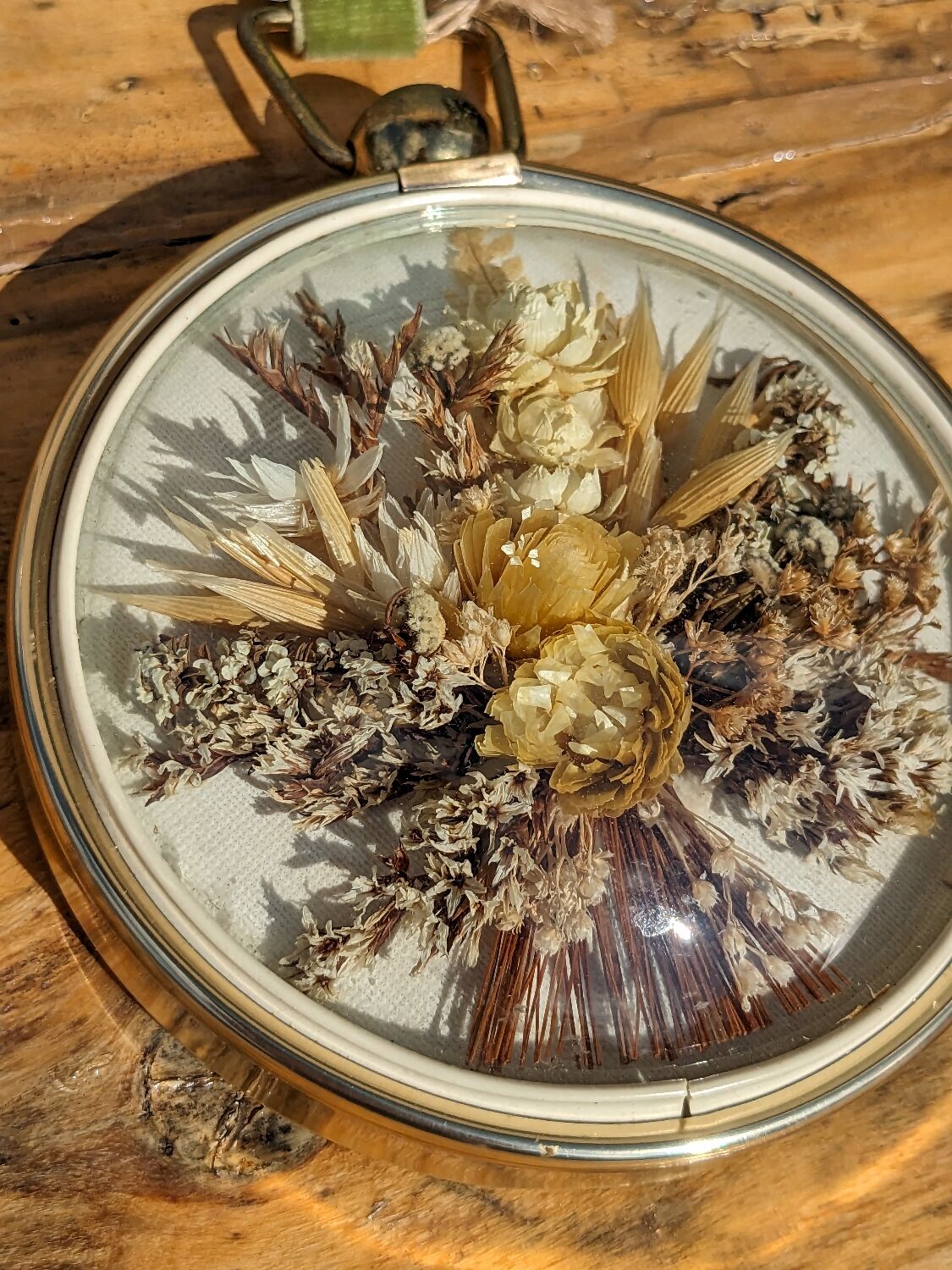 Domed frame of dried flowers
