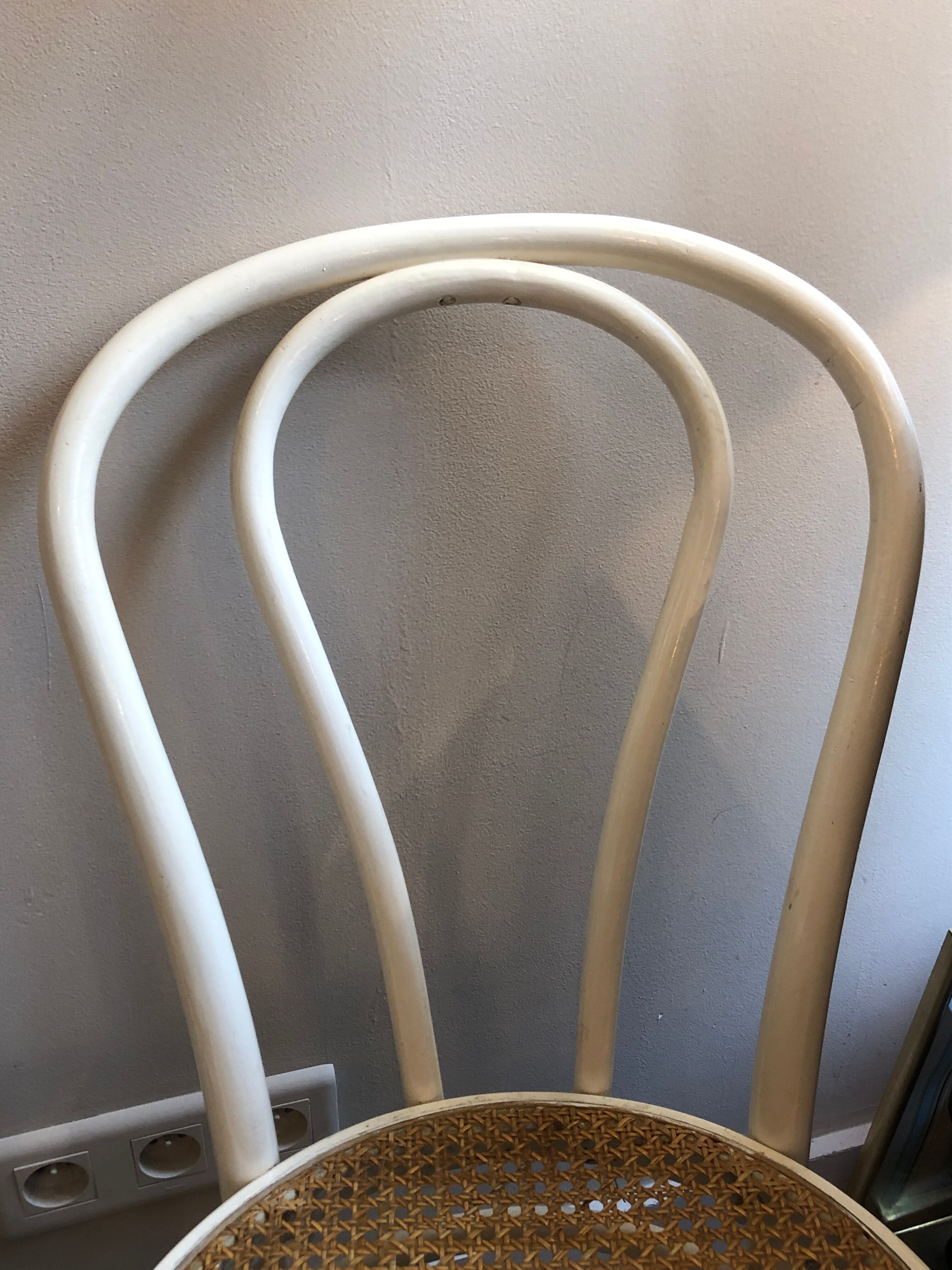Couple of white bistro chairs