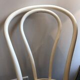 Couple of white bistro chairs