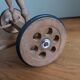 Wicker rattan doll cradle with wheels