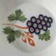Pair of antique soup plates with hand-painted grape decoration