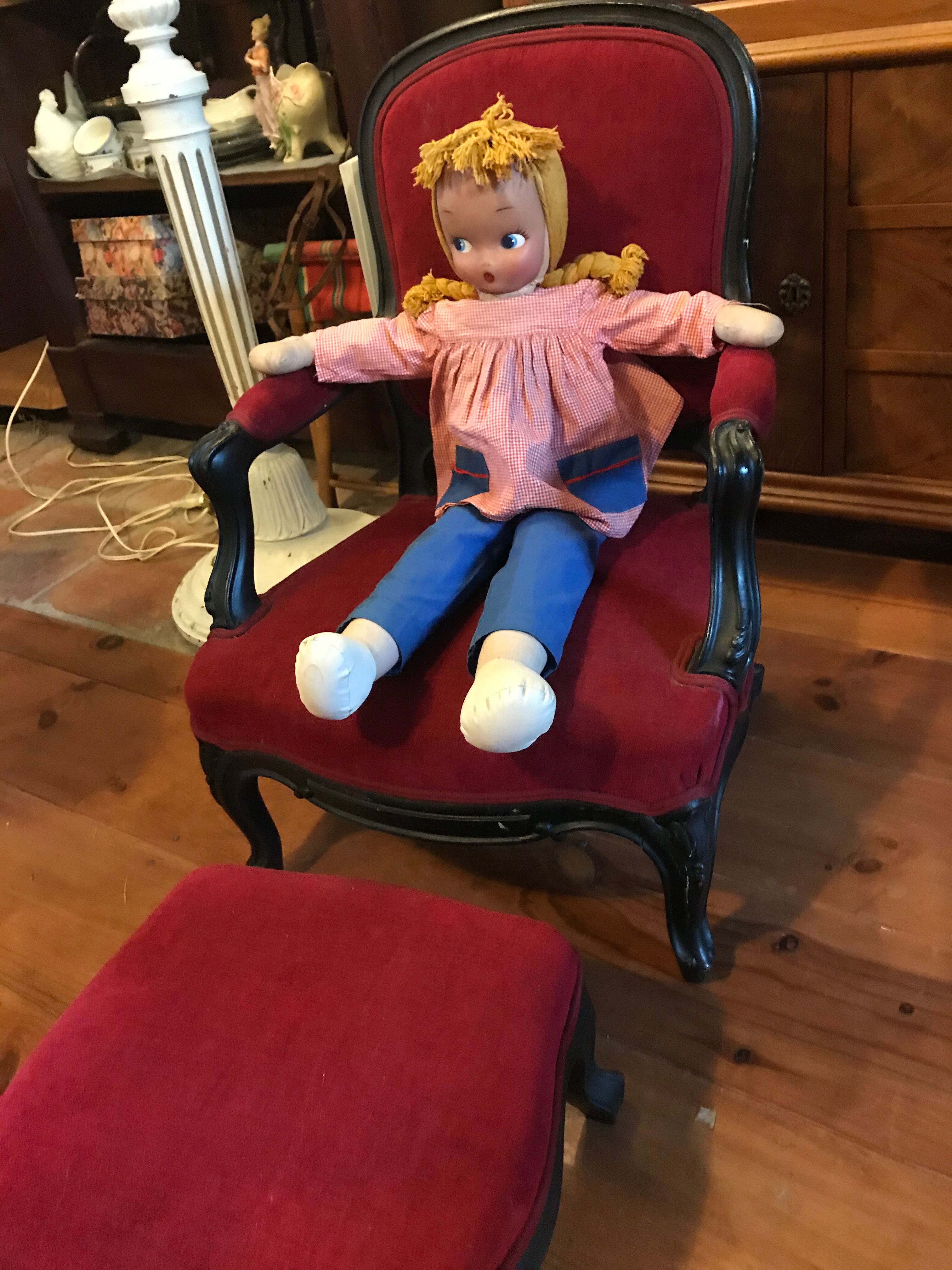 Old children's armchair with foot rests