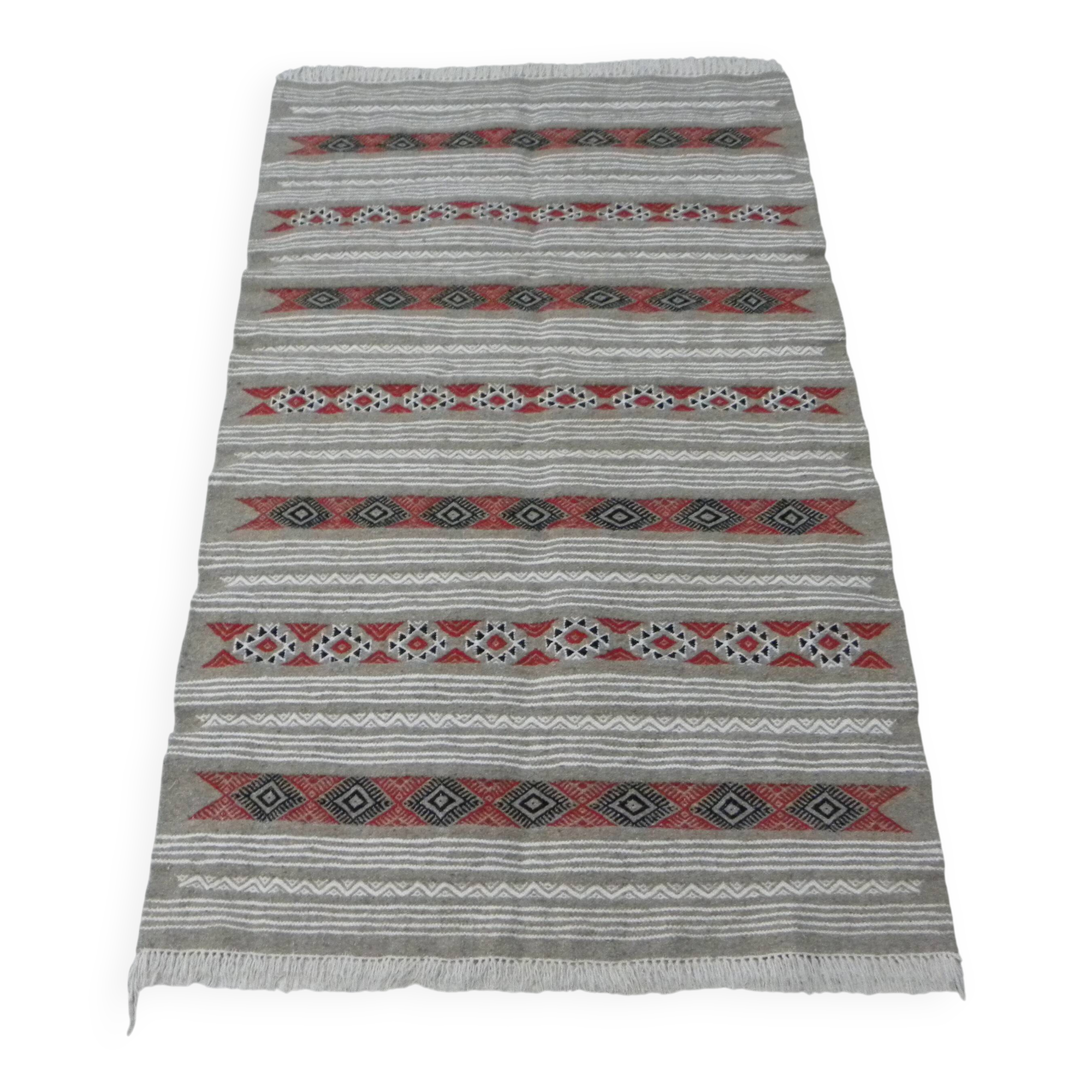 Geometric woven rug with fringes – Ethnic style – Hallway & interior