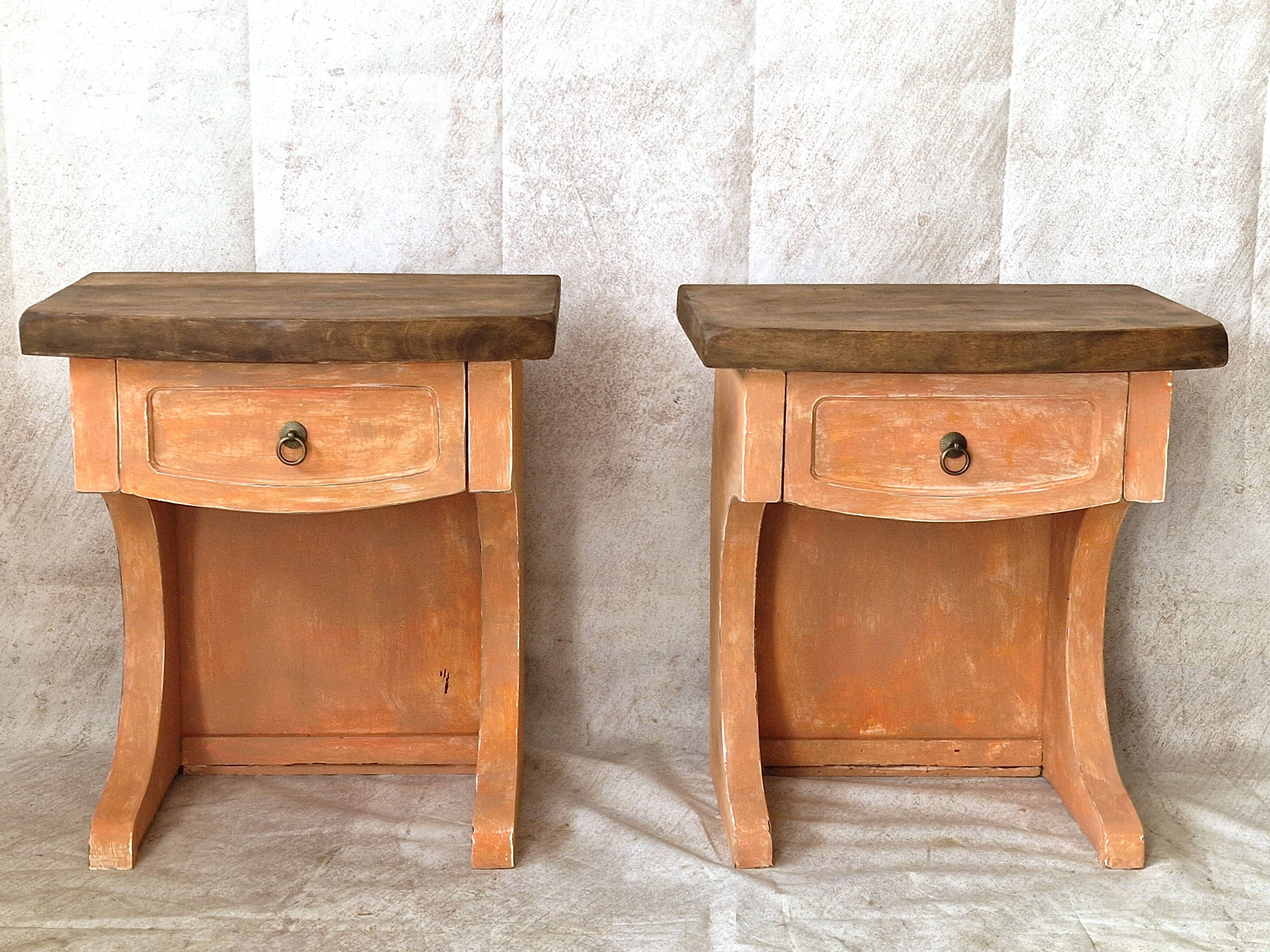 Pair of orange-pink patinated bedside tables