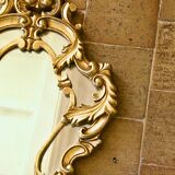 Antique Baroque mirror with gilded metal panels
