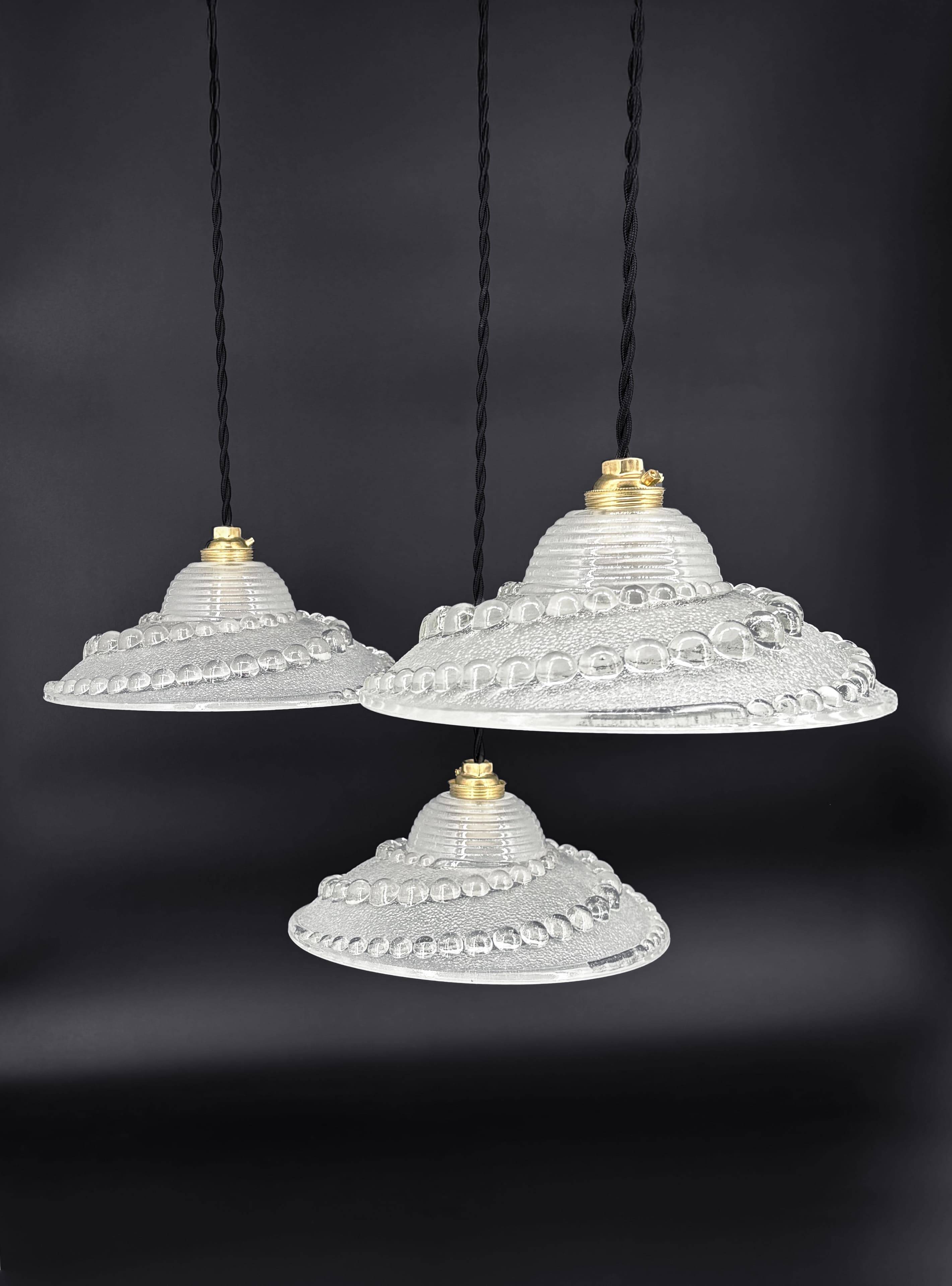 Set of 3 moulded glass pendant lights with cabochons, Art Deco style Ezan.