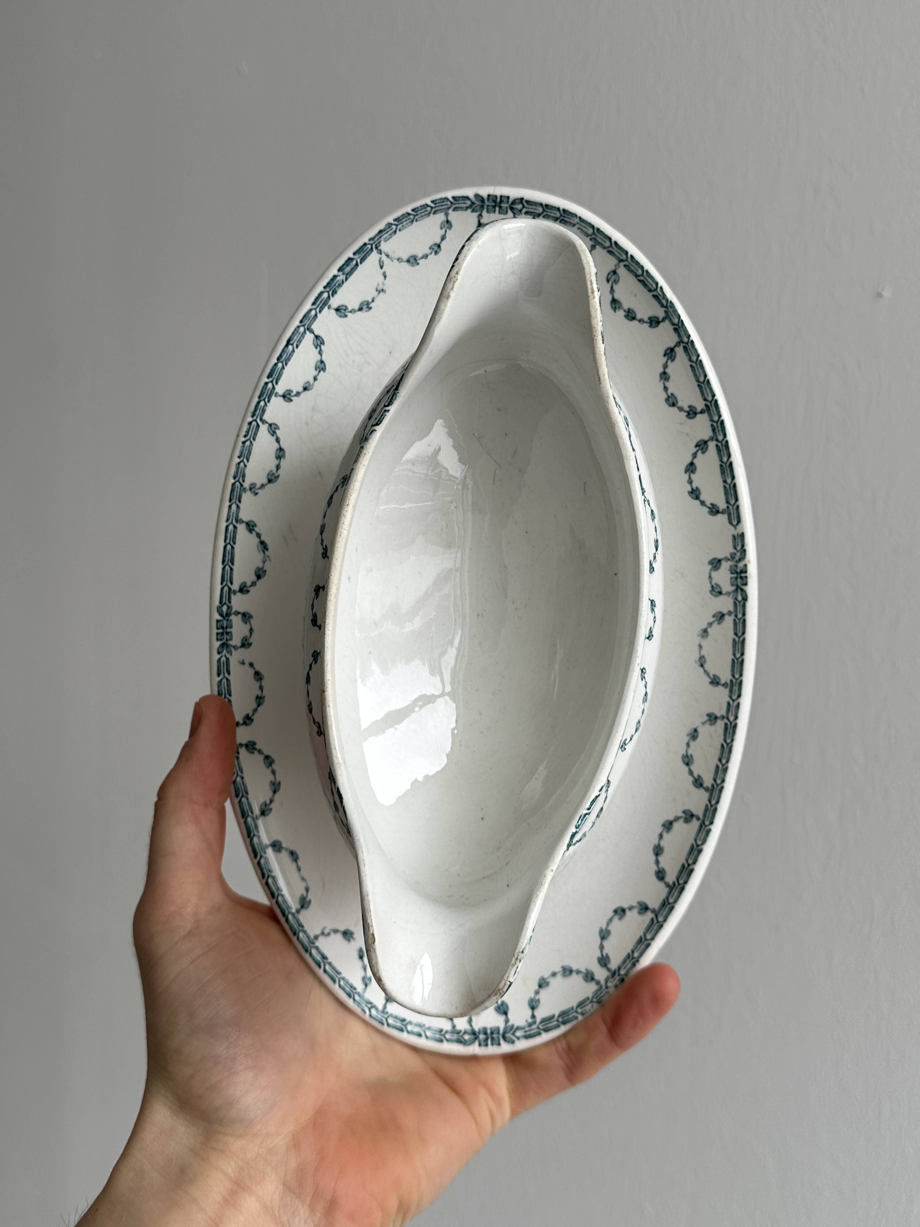 Antique porcelain sauceboat with tray
