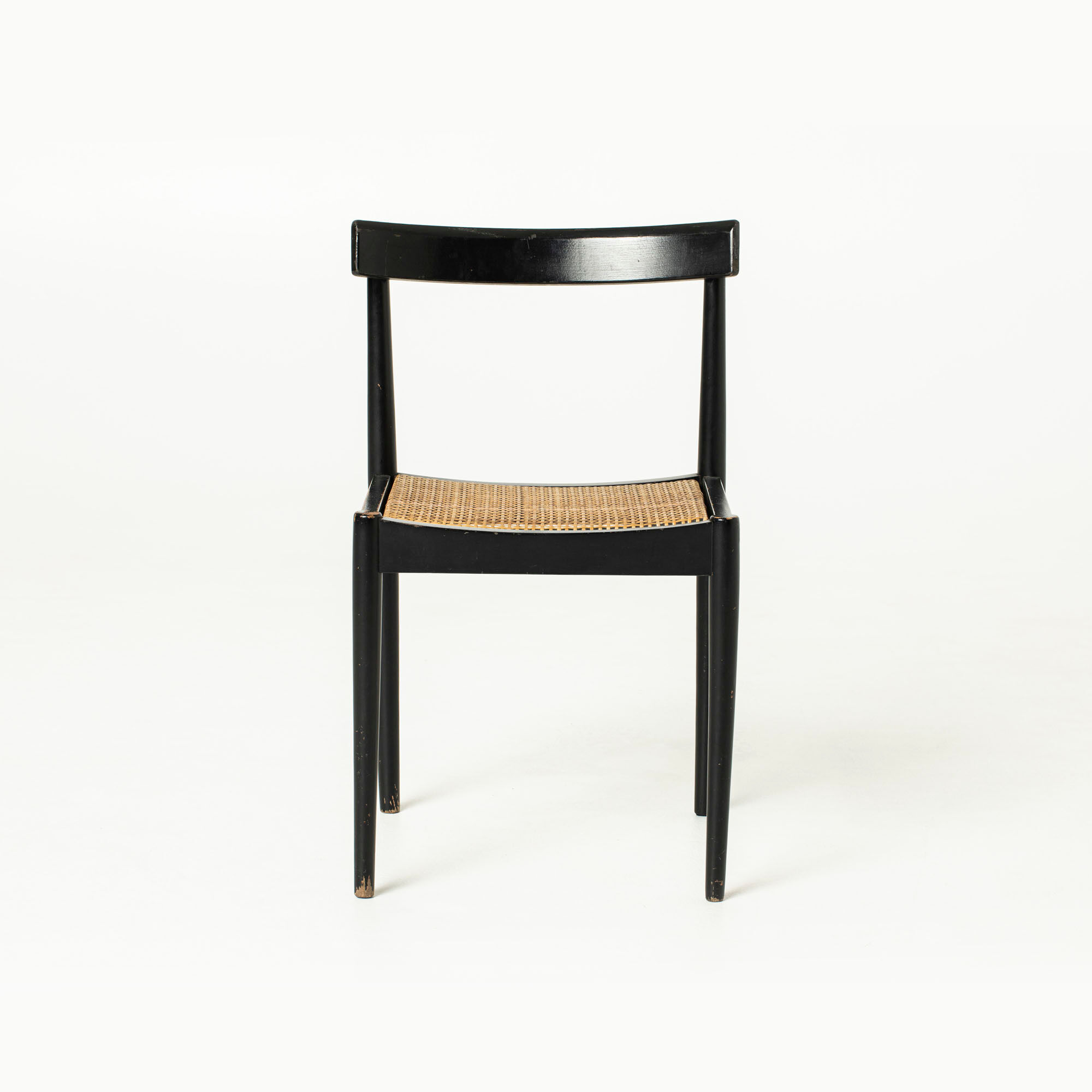 Mid-century dining chair in black laquered wood and cane