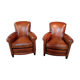 Paire de fauteuils-club en cuir