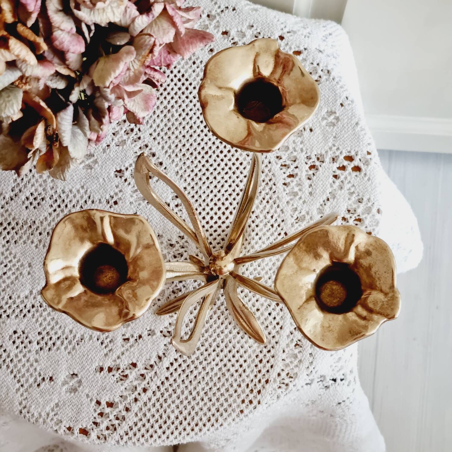 Tall brass flower candlestick