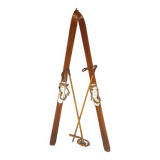 pair of vintage wooden Skis and their bats.