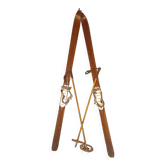 pair of vintage wooden Skis and their bats.