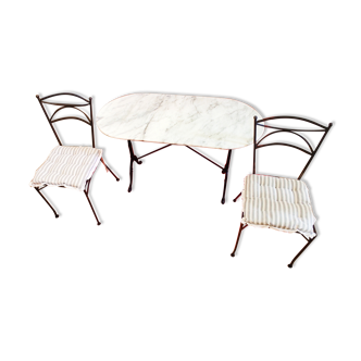 Bistro table in marble and cast iron legs and two matching chairs in black cast iron