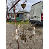 Vintage gold metal chandelier with floral decoration.