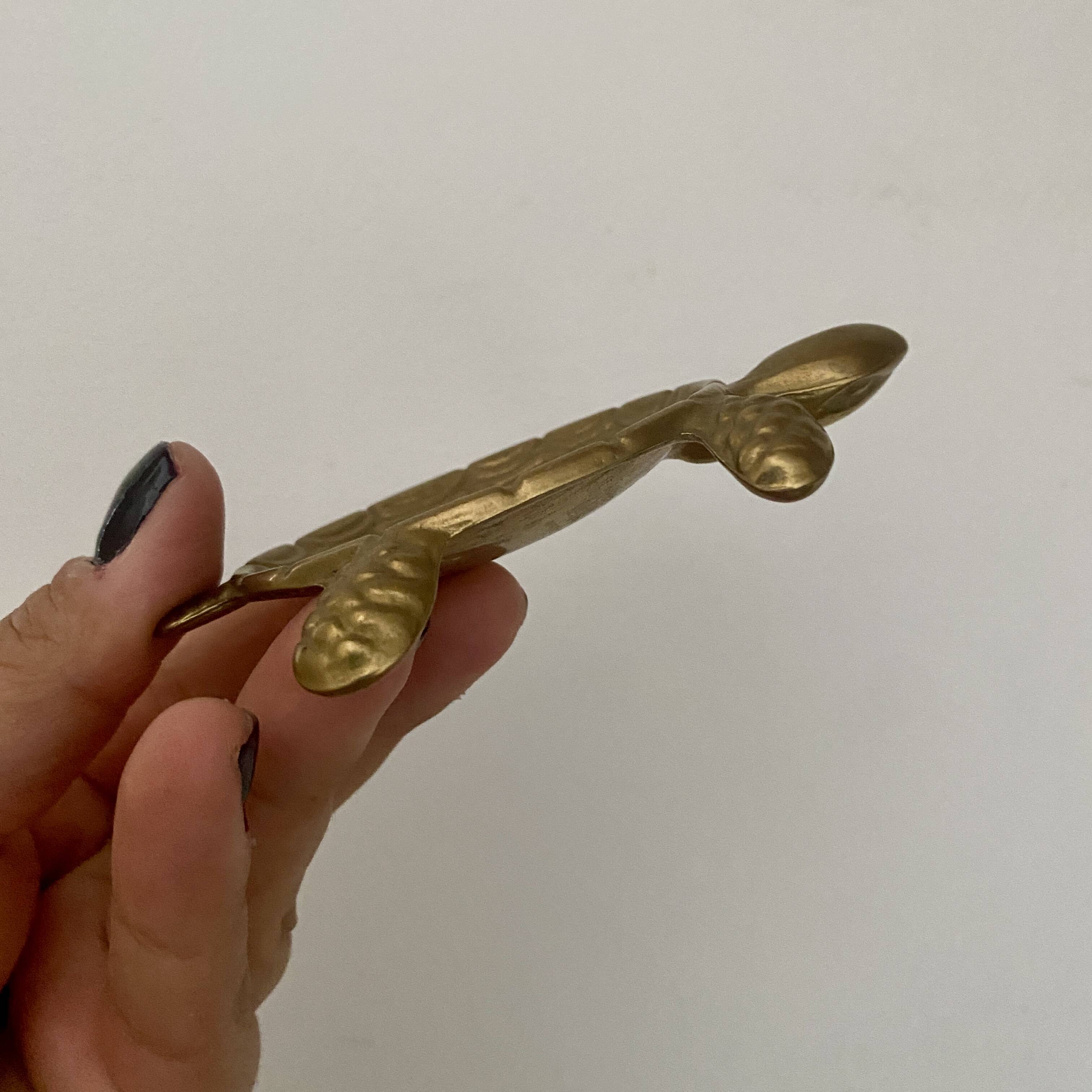 Vintage brass turtle pocket emptier