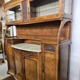 According to Gauthier-Poinsignon: large two-body buffet from the Art Nouveau period in walnut and burl.