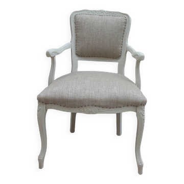 Louis XV style armchair, delicately patinated in a soft beige hue.