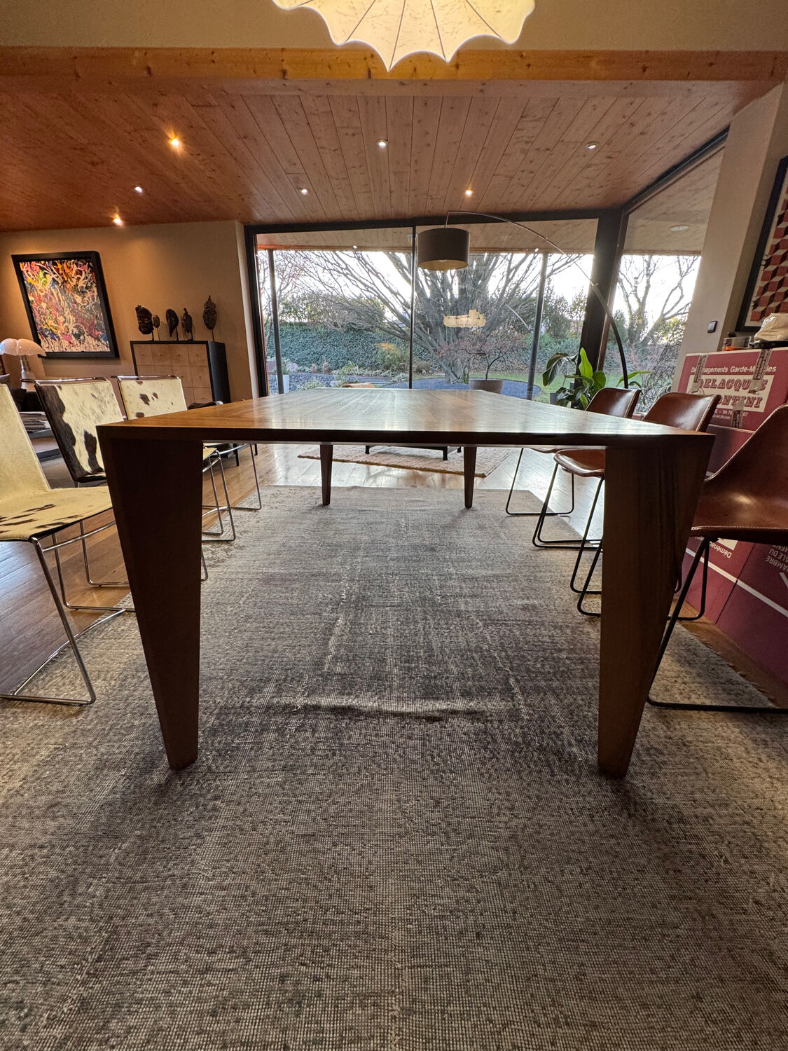 Dining table ligne roset model trapèze in solid walnut with oil finish.