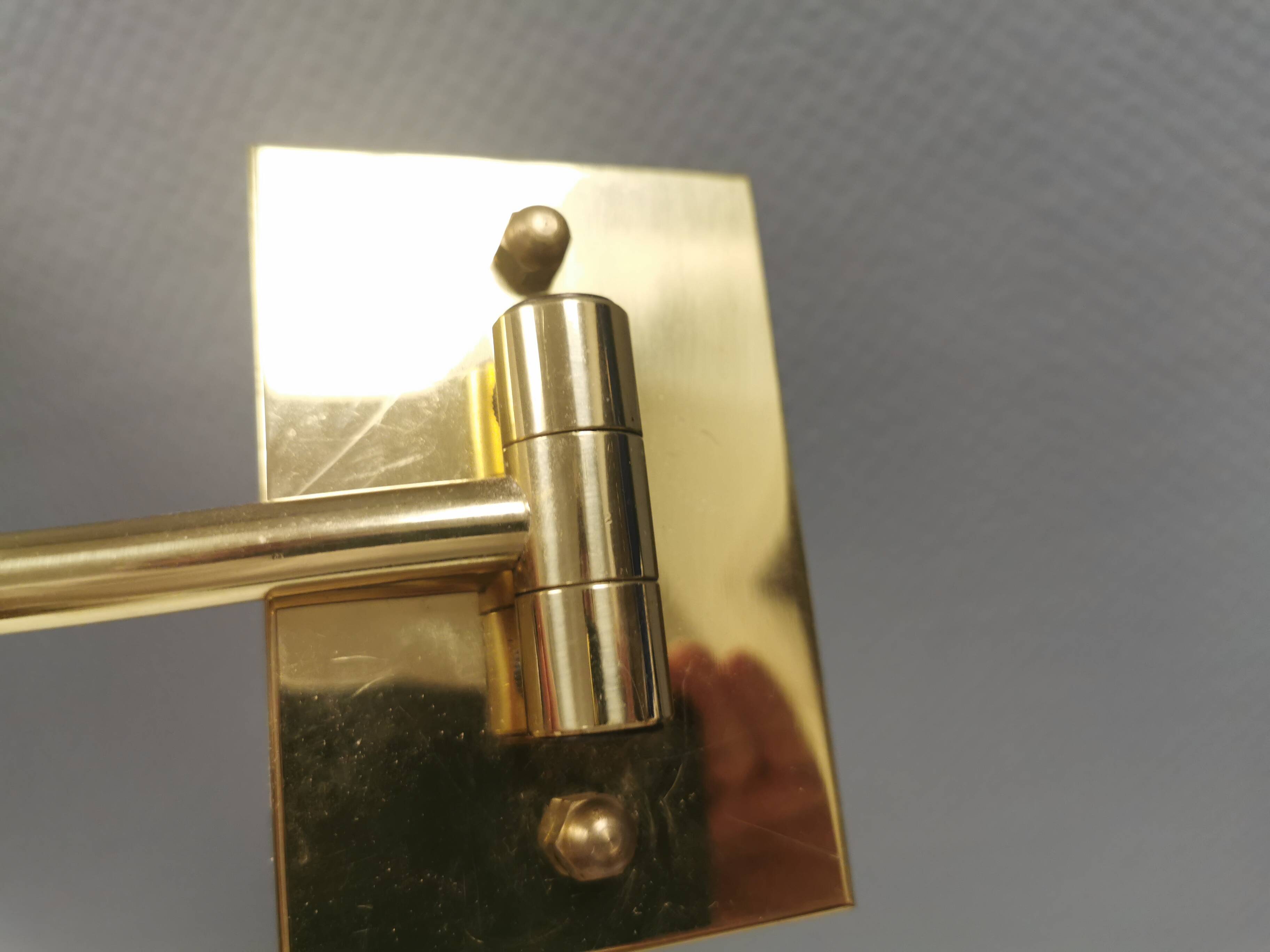 Danish Brass wall lamp with a ‘swivel’ effect.
