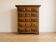 Antique solid wood chest of drawers with five drawers.
