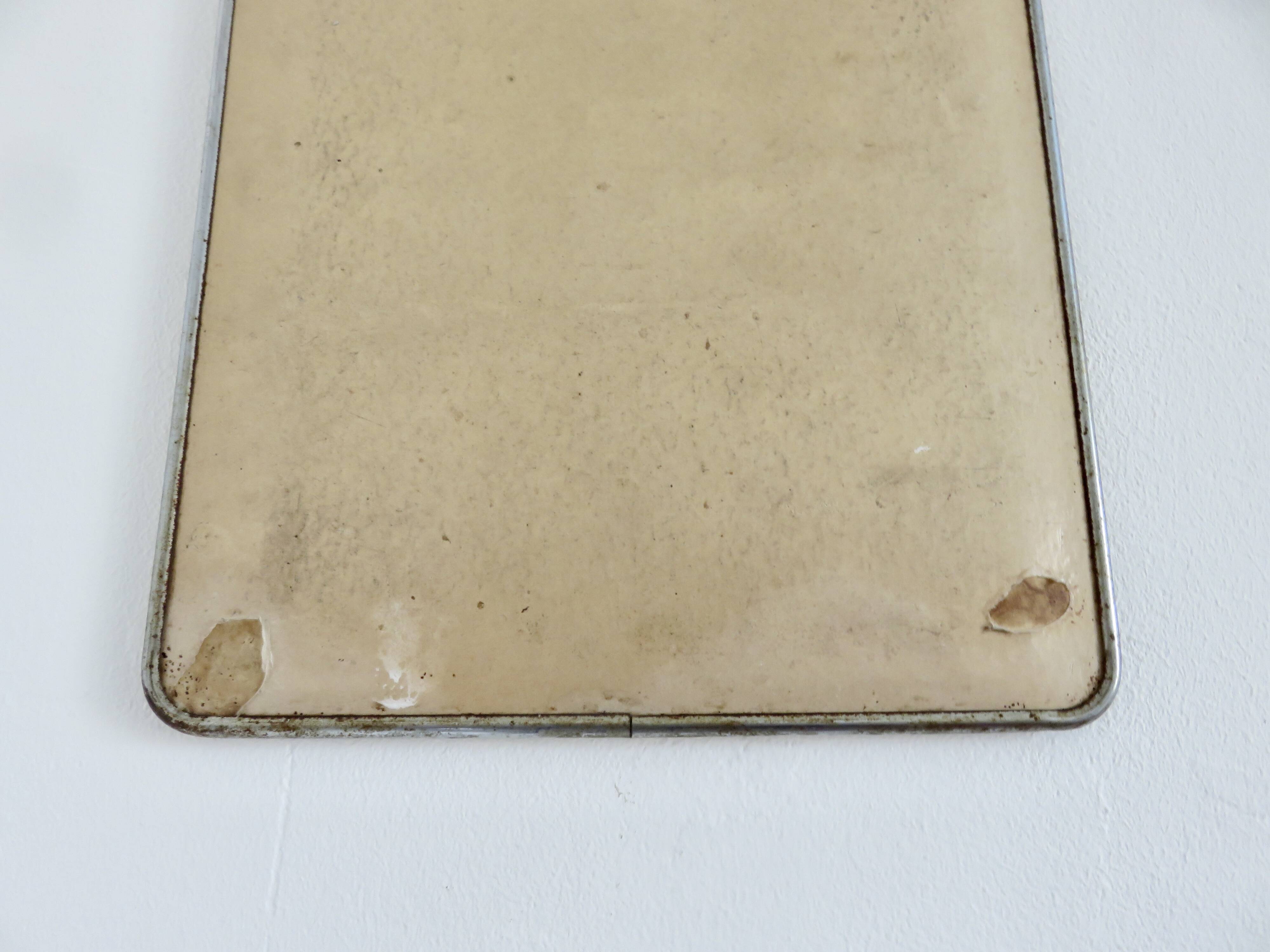 Old barber's mirror with chain, 1950s and 1960s