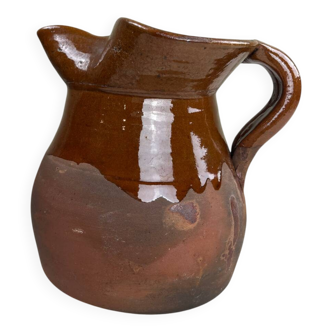 Handcrafted earthenware jug with a glazed finish