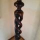 Sculptural floor lamp made of twisted turned wood.