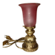 bronze bedside lamp with a pink cracked glass shade