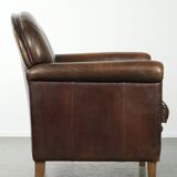 Armchair / lounge chair made of sheepskin leather with characterful patina