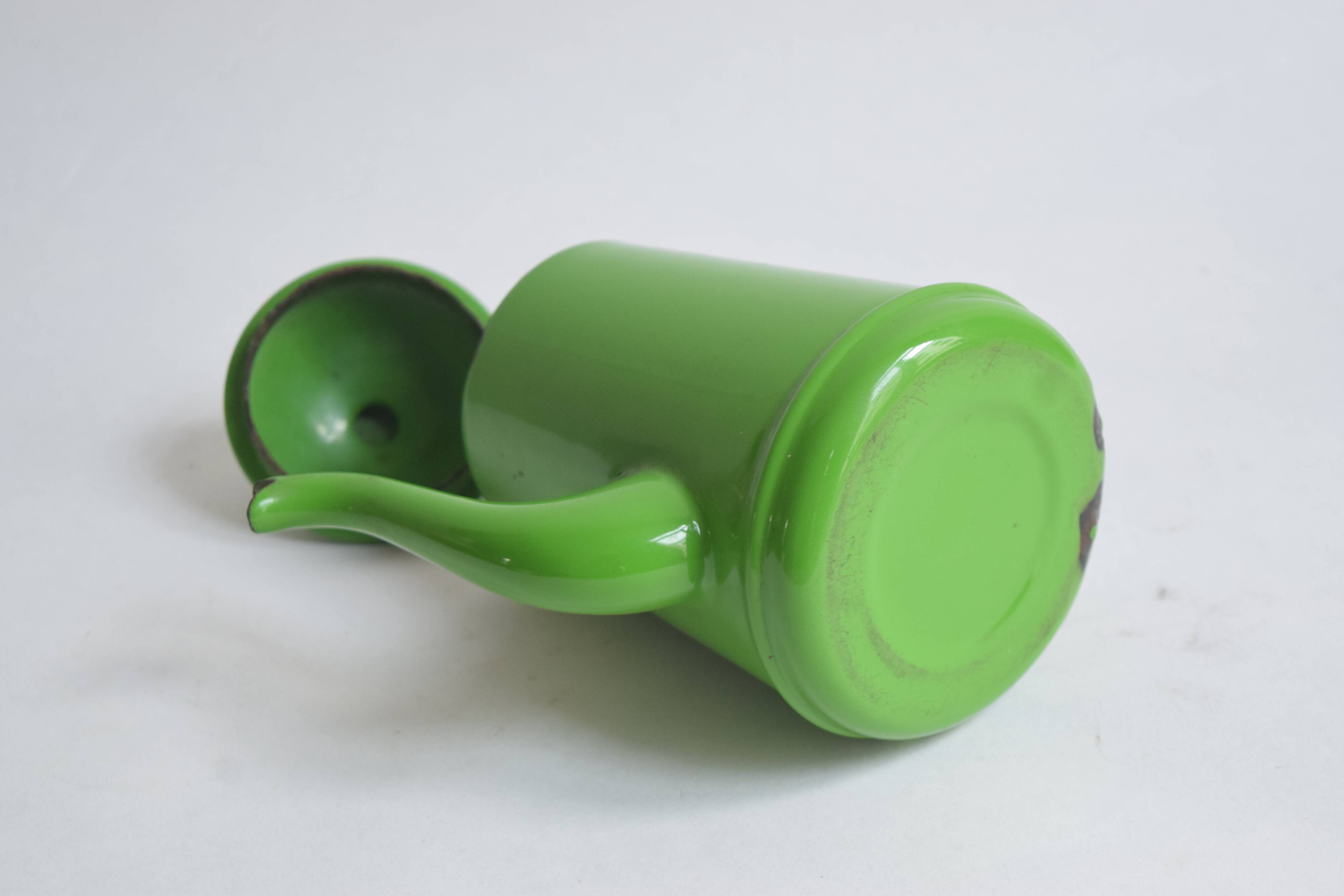 Small vintage green coffee maker in enameled sheet metal