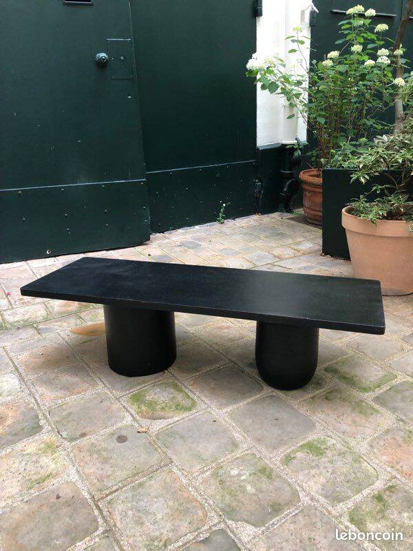 Rectangular coffee table in stained black wood with ball and cylindrical legs.