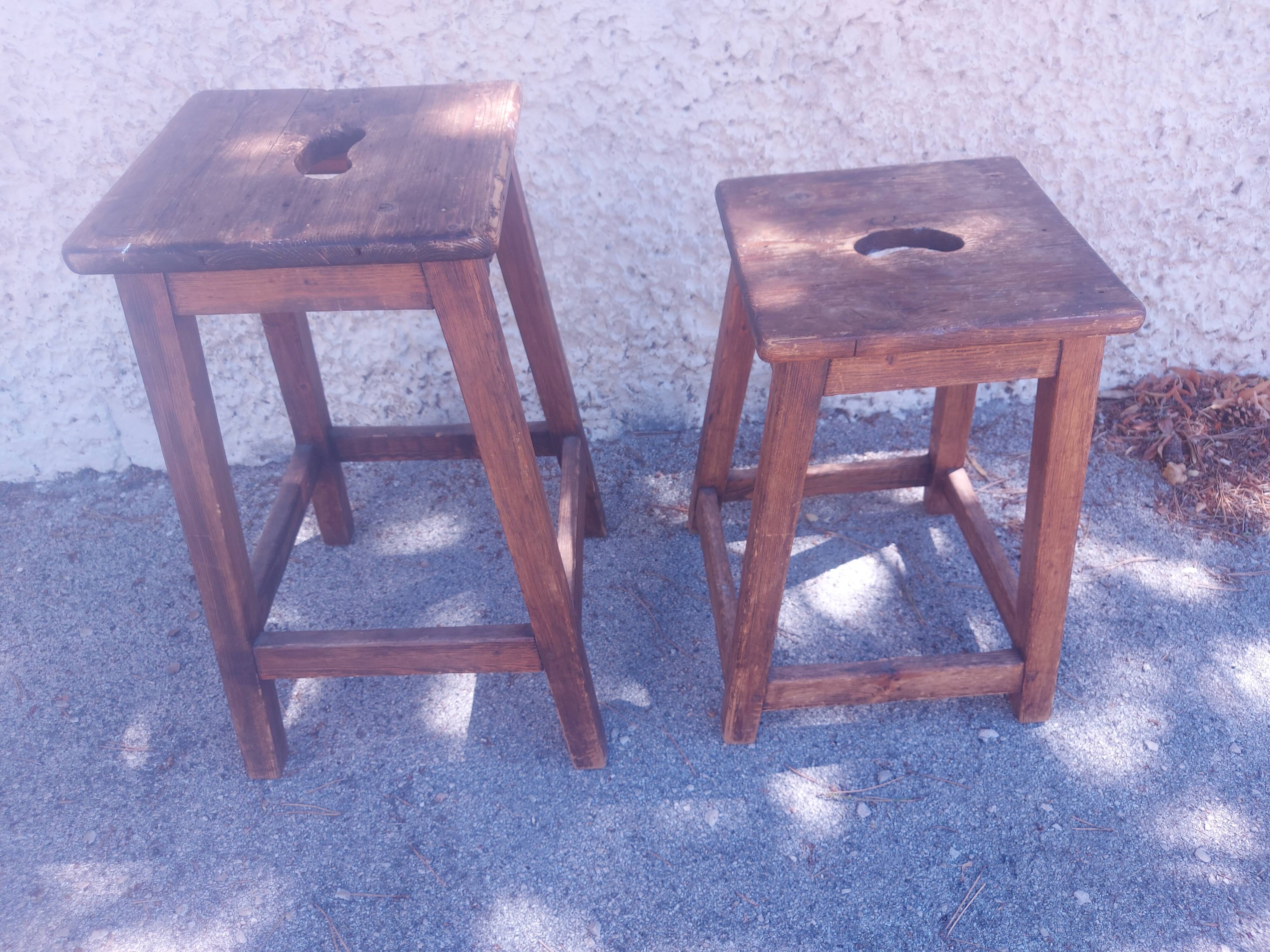 Two vintage wooden stools