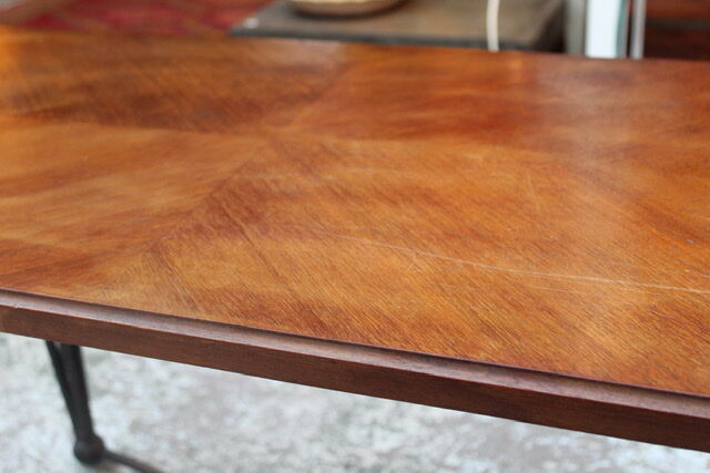 Black metal footing wooden coffee table