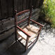 Old children's armchair in wood & straw