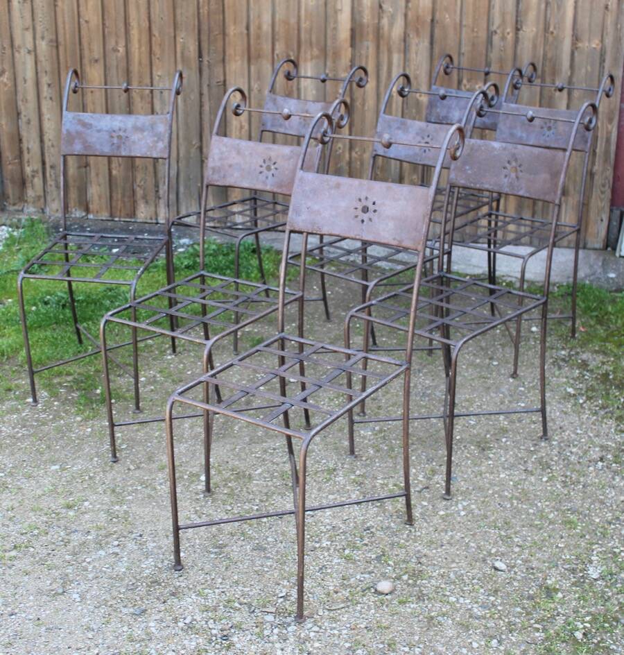 Series of 8 wrought iron garden chairs