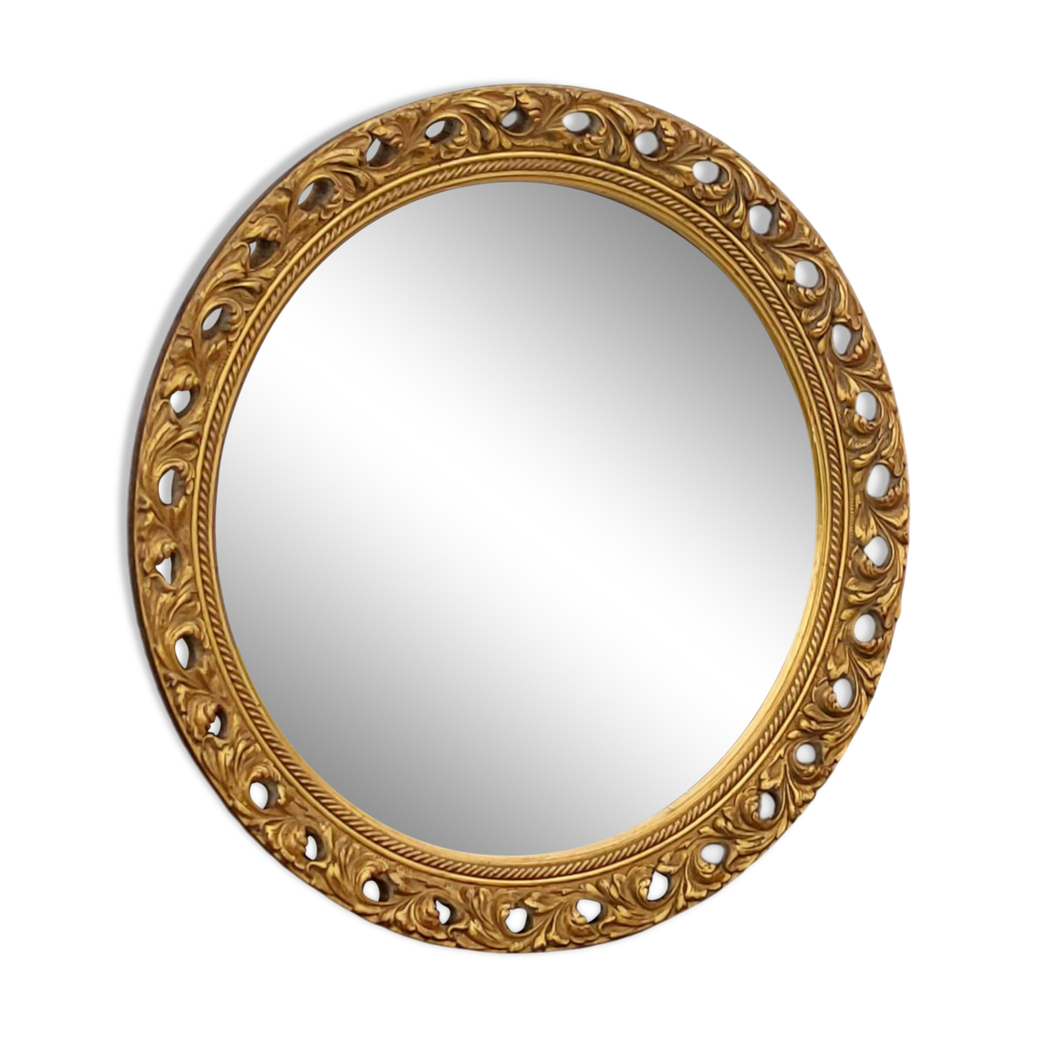 Round neoclassical style mirror in wood and gilded stucco from the 1950s